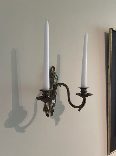 Pair of two-light ormolu sconces decorated...
