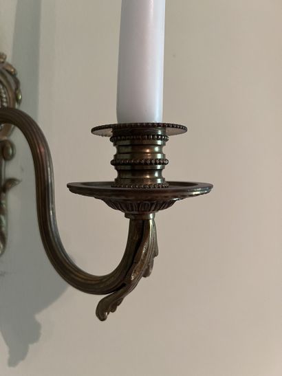 Pair of two-light ormolu sconces decorated...
