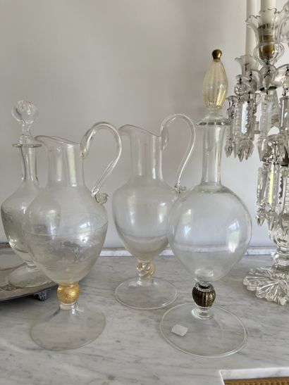 Three glass decanters, one with engraved...