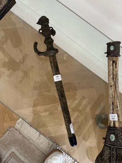 Bronze scepter. The handle is adorned with...