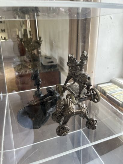 Lot of four bronze objects: A cup with fauna...