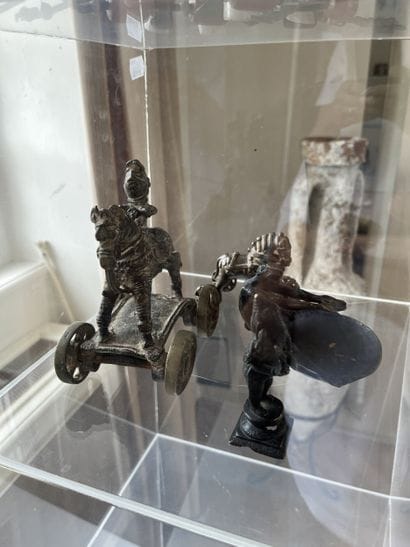 Lot of four bronze objects: A cup with fauna...