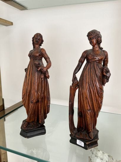 Pair of carved limewood statuettes, one depicting...