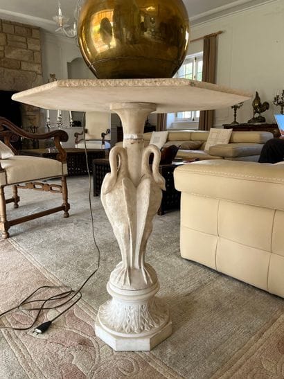 Octagonal pedestal table in composite white...