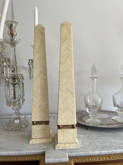 Pair of obelisks in galalith plates and gilded...