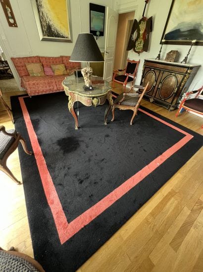 Black carpet with coral braid border. 
Contemporary...