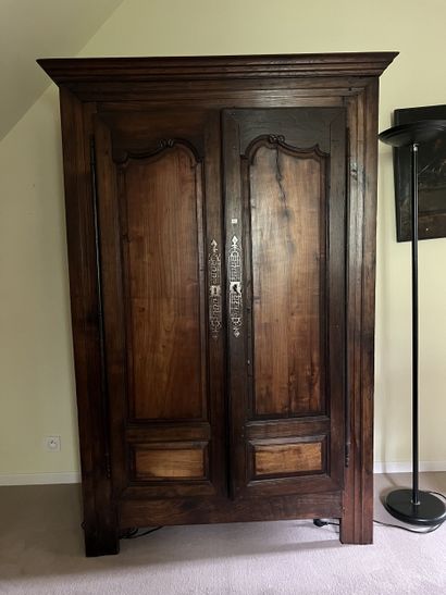 Moulded chestnut cupboard opening to two...
