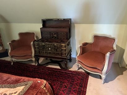 Pair of bergères in molded and carved wood...