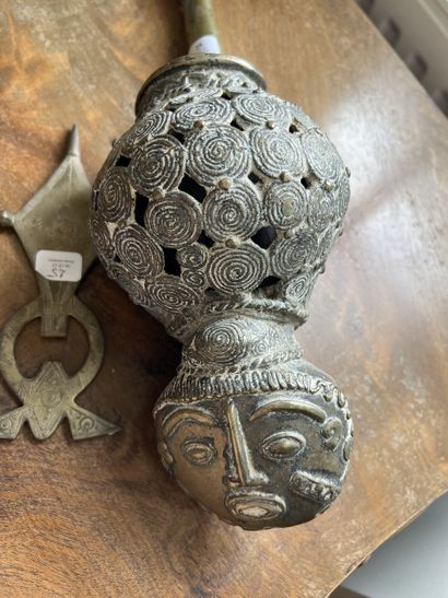 Bronze pipe. Length: 50 cm. Cameroon. 
And...