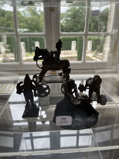 Lot of four bronze objects: A cup with fauna...