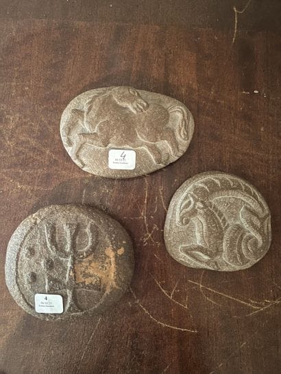Set of three antique-inspired carved pebbles...