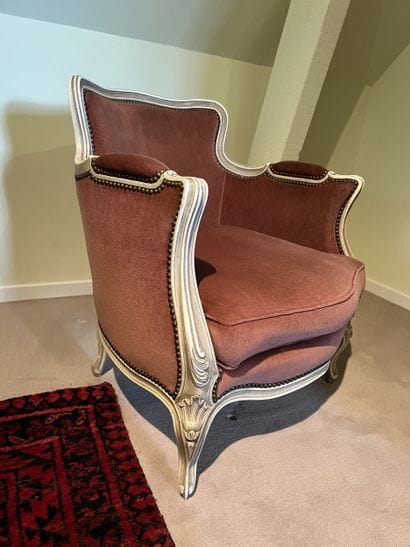 Pair of bergères in molded and carved wood...