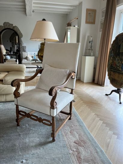 Suite of three molded and carved walnut armchairs,...