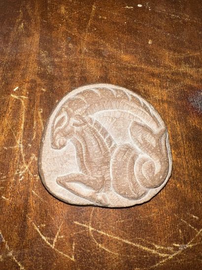 Set of three antique-inspired carved pebbles...