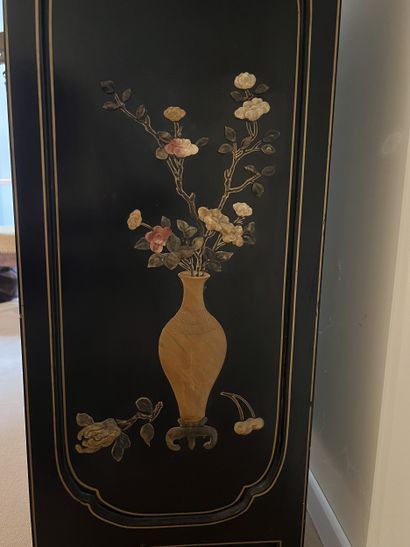 Small low piece of furniture in black lacquered...