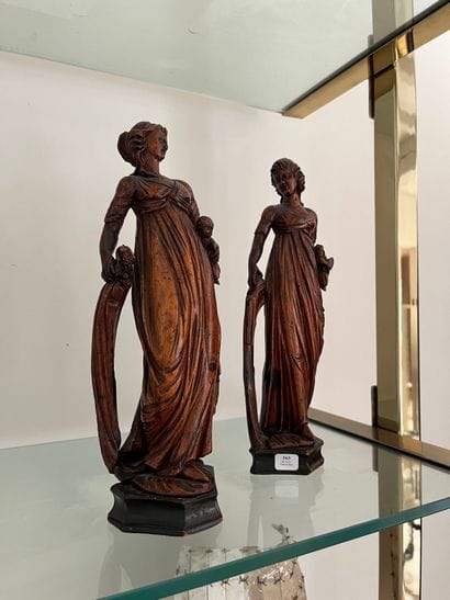 Pair of carved limewood statuettes, one depicting...