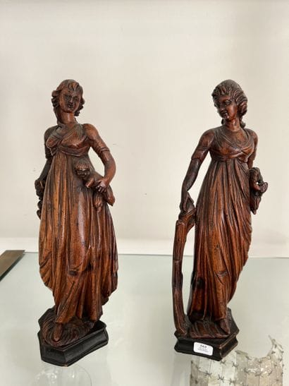 Pair of carved limewood statuettes, one depicting...