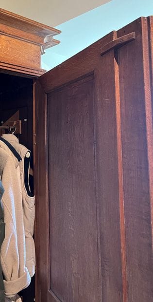 Molded and carved oak armoire. Opens to two...