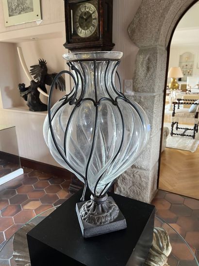 Blown glass vase, molded in a metal frame,...