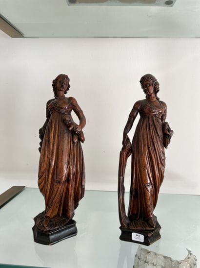 Pair of carved limewood statuettes, one depicting...