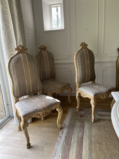 Suite of twelve chairs in lacquered wood...