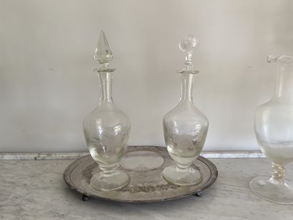 Two small glass decanters engraved with vine...