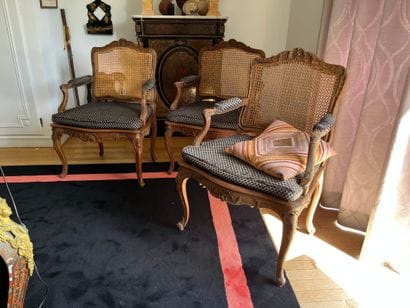 Suite of three caned armchairs in beech,...