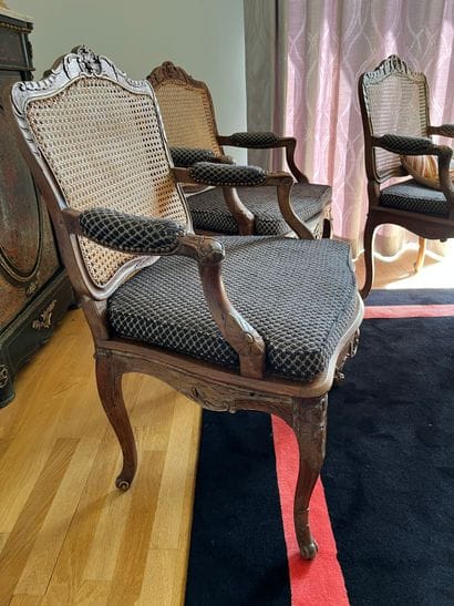 Suite of three caned armchairs in beech,...