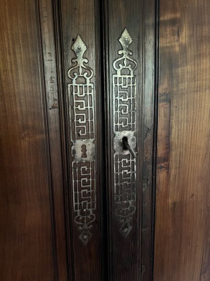 Moulded chestnut cupboard opening to two...