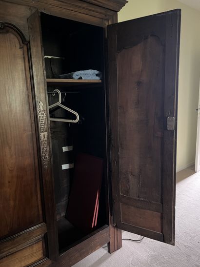 Moulded chestnut cupboard opening to two...