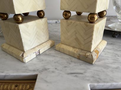 Pair of obelisks in galalith plates and gilded...