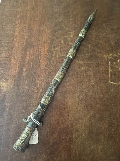 Iron spear point engraved with stylized motifs....
