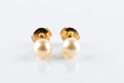 Pair of yellow gold earrings adorned with...
