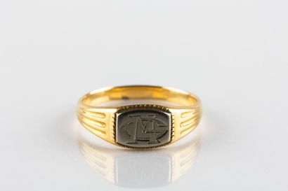 Chevalière in yellow and white gold engraved...