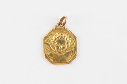 Yellow gold octagonal medal featuring a cherub....
