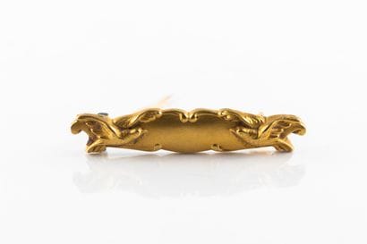 Broche de bavoir en or jaune figurant deux...