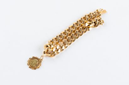 Bracelet en or jaune, maille gourmette accompagnée...