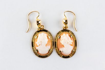 Pair of yellow gold earrings set with a smooth...