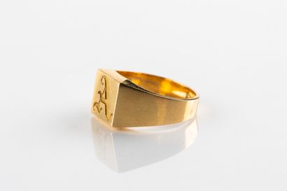 Solid yellow gold signet ring engraved with...