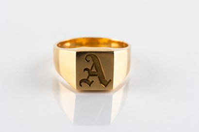Solid yellow gold signet ring engraved with...