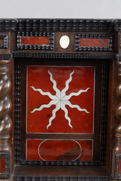 Display case with a niche framed by twisted...