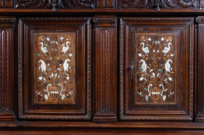 Two-part cabinet in molded and carved walnut,...