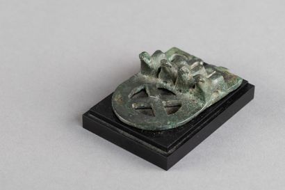 Belt buckle decorated with four mammals....