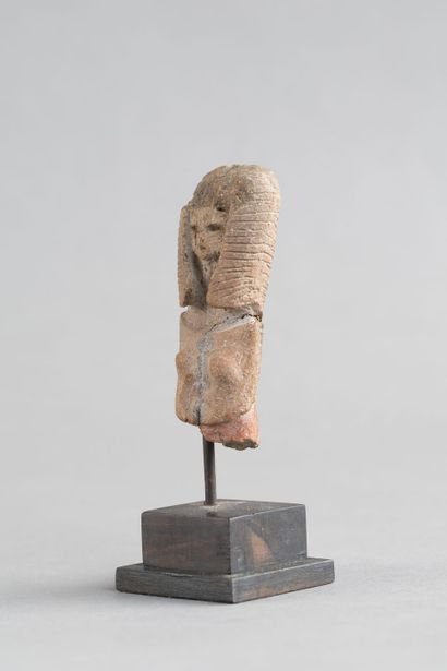 Bust of a female statuette. Terracotta with...