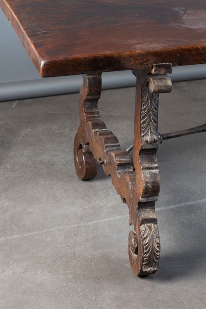 Large walnut table with a lyre-shaped base...