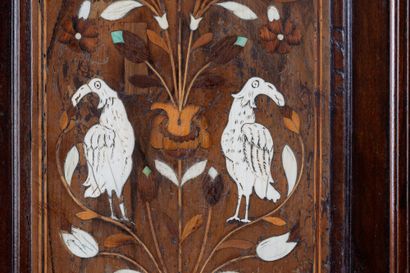 Two-part cabinet in molded and carved walnut,...