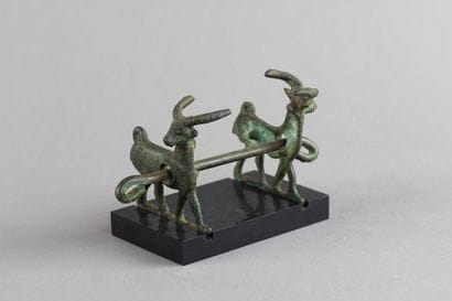 Horse bit decorated with two goats. Bronze....