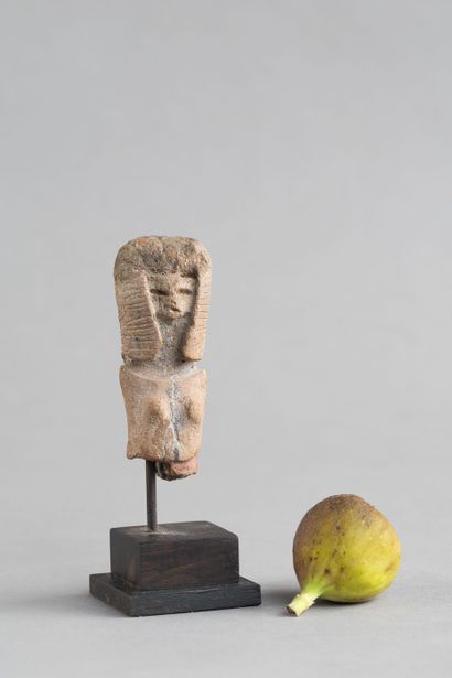 Bust of a female statuette. Terracotta with...