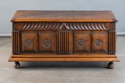 Walnut chest with a front panel featuring...