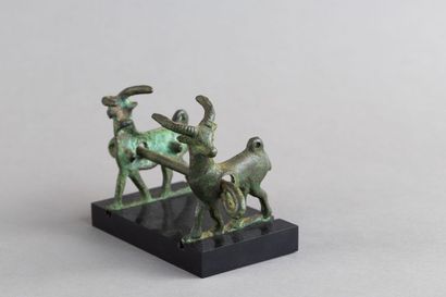 Horse bit decorated with two goats. Bronze....